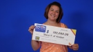 Windsor resident Sherri Pukay with her OLG cheque for $100,000 after winning at ENCORE. (courtesy OLG)
