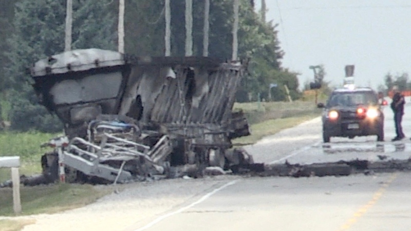 What remains of a transport truck is seen after a fiery two-vehicle crash on Highbury Avenue north of London, Ont. on Wednesday, July 8, 2020. (Jim Knight / CTV News)