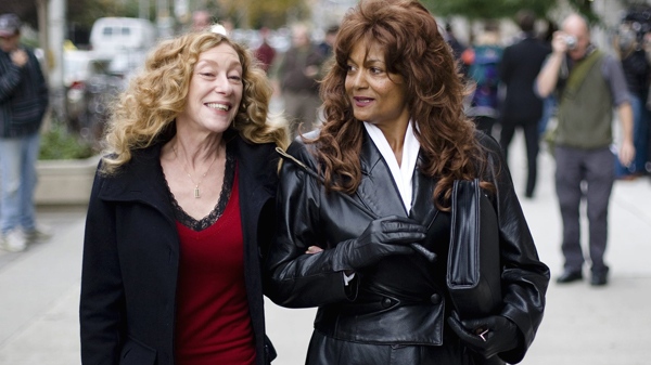Dominatrix Terri-Jean Bedford, right, carries a riding crop while walking with sex workers advocate Valerie Scott in front of Ontario Superior Court in Toronto on Tuesday, Oct. 6, 2009. (Darren Calabrese / THE CANADIAN PRESS)