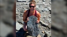 Erin Levy poses with the 310-million-year-old fossil she found in Joggins, N.S. (Submitted: Erin Levy)