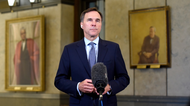 Minister of Finance Bill Morneau participates in a remote TV interview in the Foyer of the House of Commons on Parliament Hill after presenting a fiscal snapshot that is expected to reveal the economic impact of the COVID-19 pandemic, in Ottawa, on Wednesday, July 8, 2020. THE CANADIAN PRESS/Justin Tang