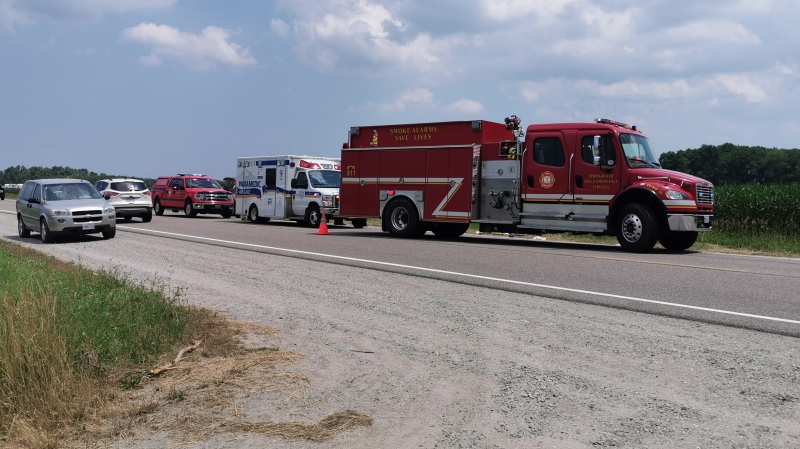 Emergency crews at the scene of a fatal collision between a motorcycle and farm tractor on Hwy 26 near Horseshoe Valley Road in Springwater Twp., Ont., on Fri., July 10, 2020. (Don Wright/CTV News)