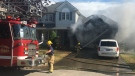 St. Thomas Fire Department arrived at a garage fire at Windemere Place on Sunday, July 12, 2020 (Brent Lale / CTV News)