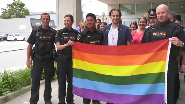 The rainbow flag is raised outside London police headquarters in London, Ont. in July 2019.