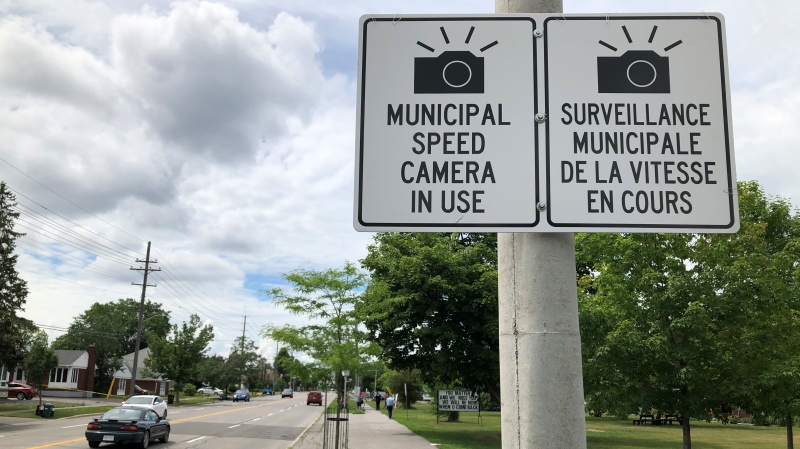 Signs warning drivers that photo radar cameras are ahead. (Dave Charbonneau / CTV News Ottawa)