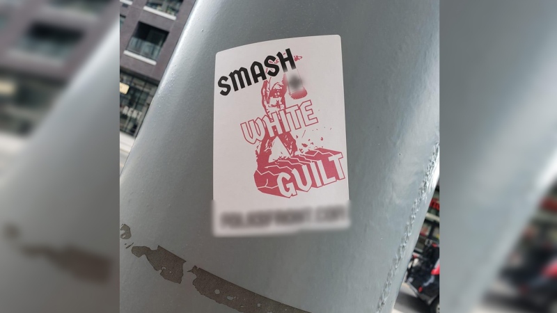 Several photos of these stickers were shared on social media over the weekend after they were reportedly seen around Kitchener. (@smoestoe / Twitter)