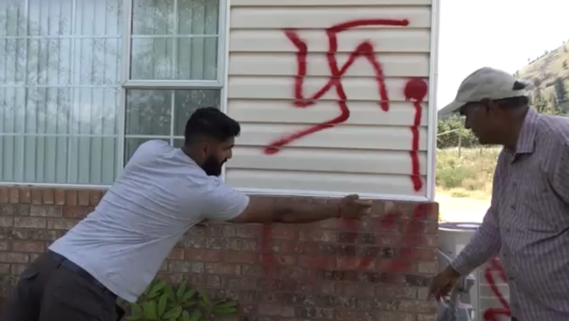 The Lekhi family in Summerland, B.C. surveys racist graffiti that was left on their home this week. 