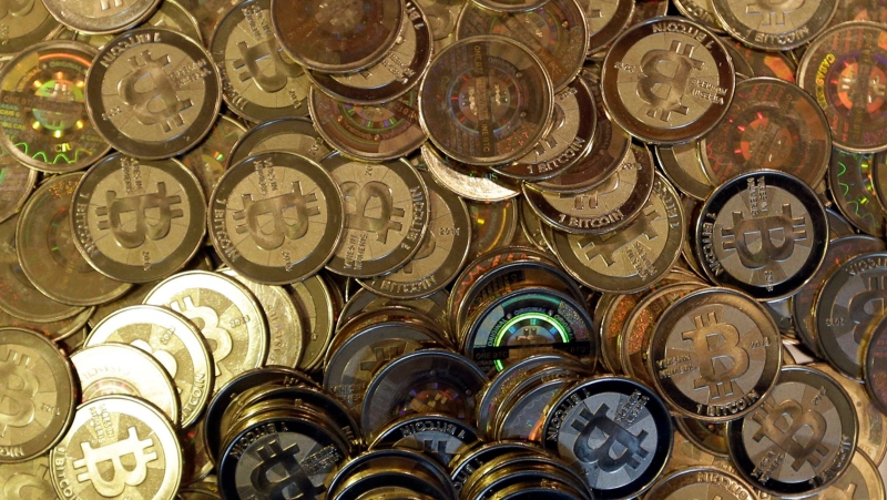 This April 3, 2013, file photo shows bitcoin tokens in Sandy, Utah. (AP Photo/Rick Bowmer, File)