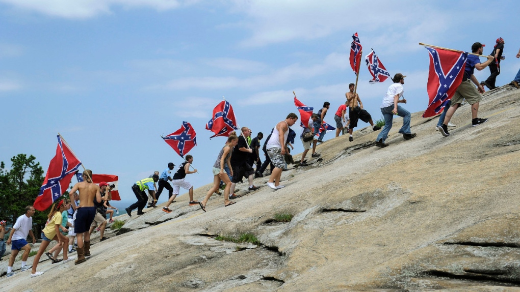 Carrying Confederate battle flags