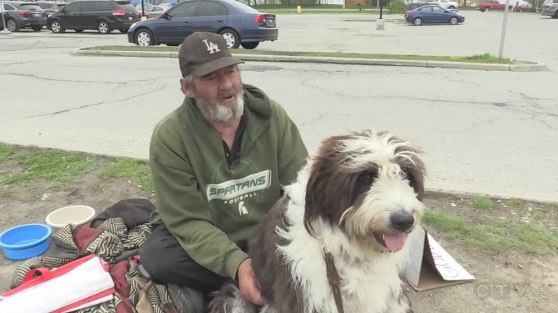 Mick Watson is seen with his dog Bender in London, Ont. in May 2018. (CTV News) 
