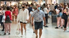 Shoppers wear masks at a mall on the third day of Quebec's mandatory mask order for all indoor public spaces July 20, 2020 in Laval, Que. THE CANADIAN PRESS/Ryan Remiorz
