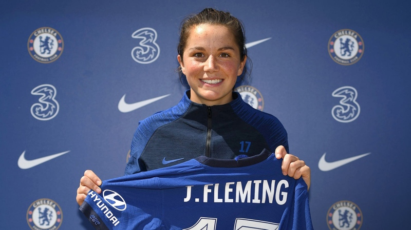 Jessie Fleming, from London, Ont., holds up her new jersey after signing with the Chelsea FCW. (Source: Chelsea Football Club Women / Facebook)