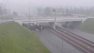A group of drivers took shelter under a highway overpass in northwest Calgary to wait out a severe thunderstorm and tornado warning Thursday. (Supplied/City of Calgary)