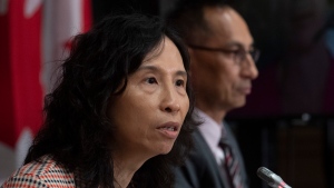 Deputy Chief Public Health Officer Howard Njoo looks on as Chief Public Health Officer Theresa Tam responds to a question during a news conference Friday July 24, 2020 in Ottawa. THE CANADIAN PRESS/Adrian Wyld