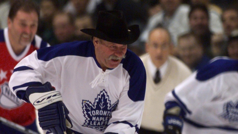 Toronto Maple Leafs' forward Eddie (The Entertainer) Shack, decked out in a cowboy hat, heads up ice with the puck during the Heroes of Hockey oldtimers game at the NHL All-Star weekend in Toronto, Saturday, Feb. 5, 2000. (CP PHOTO/Kevin Frayer)