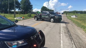 South Simcoe Police investigate a multi-vehicle collision at the 6th Line and 20 Sideroad in Innisfil, Ont., on Wed., July 29, 2020. (Dave Sullivan/CTV News)