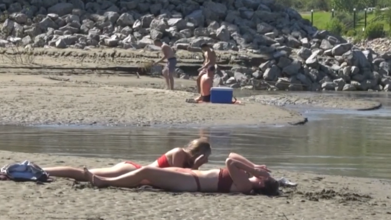 Beach-goers enjoy some summer sun on Edmonton's "Accidental Beach" on July 29, 2020 