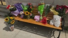 Memorial to Ingersoll, Ont. woman who died July 31, 2020 shortly after she was struck by a transport while pushing a baby stroller. (Sean Irvine/CTV London) 

