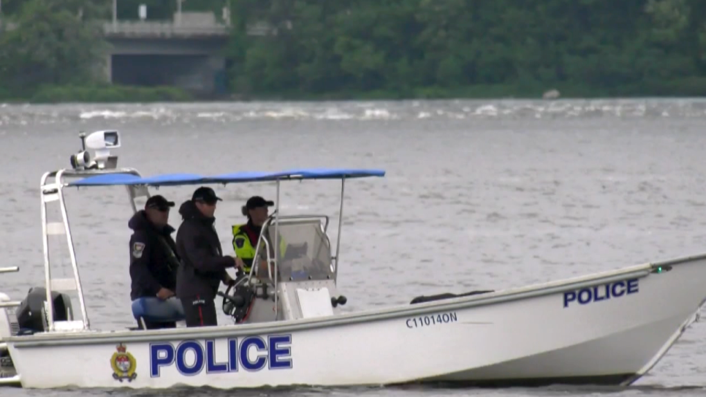 Ottawa Police officers on a boat on Ottawa River