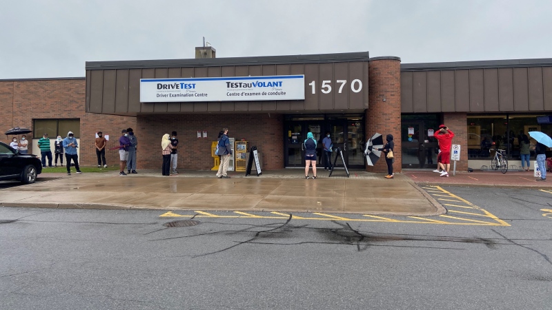 Drivers wait in line on a rainy Aug. 4, 2020 outside the DriveTest Centre on Walkley Road in Ottawa for a chance to take a G2 road test. (Dylan Dyson / CTV News Ottawa)