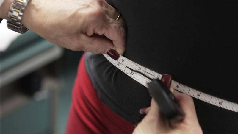 In this file photo, a waist is measured during an obesity prevention study at Rush University Medical Center in Chicago. (THE CANADIAN PRESS/AP-M. Spencer Green)