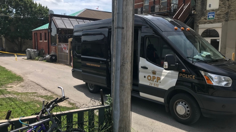OPP forensic investigators work at the scene of a shooting in a Frank Street alley in Strathroy, Ont., Monday, Aug. 10, 2020. (Sean Irvine / CTV News)