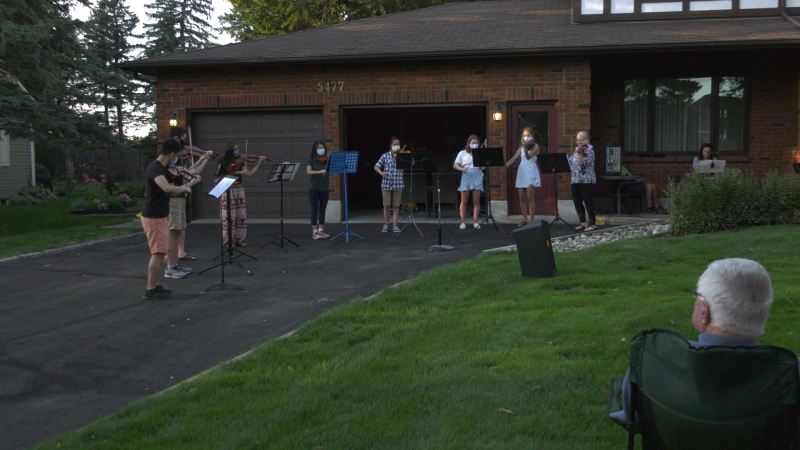 Musicians played a concert in the front yard of Elaine Klimasko, a founding member of the NAC Orchestra. (Shaun Vardon/CTV News Ottawa)