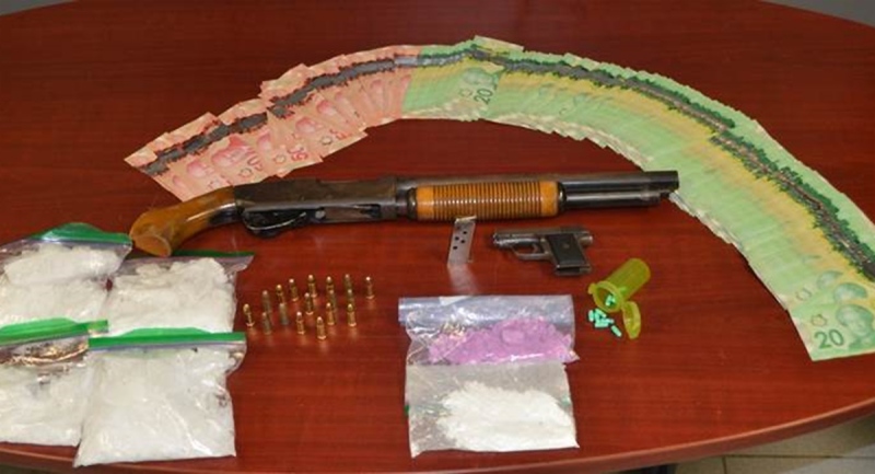 Drugs, weapons and cash seized on Wednesday, Aug. 12, 2020 are seen in this image released by the Chatham-Kent Police Service.