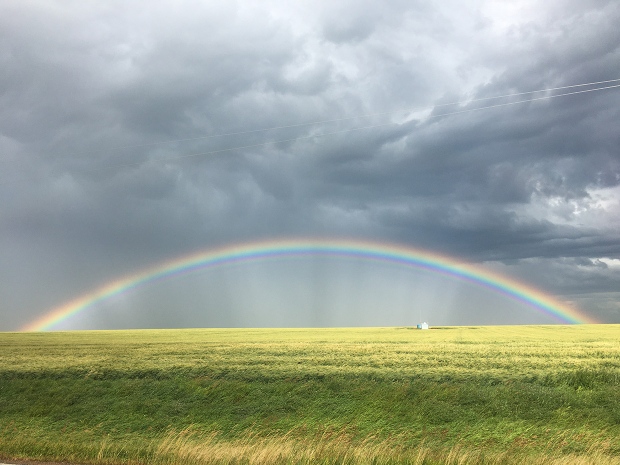 Rainbow, storm clouds, prairies
