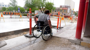 Allen Mankewich tries to maneuver his wheelchair through construction. (Source: Mike Arsenault/CTV News)
