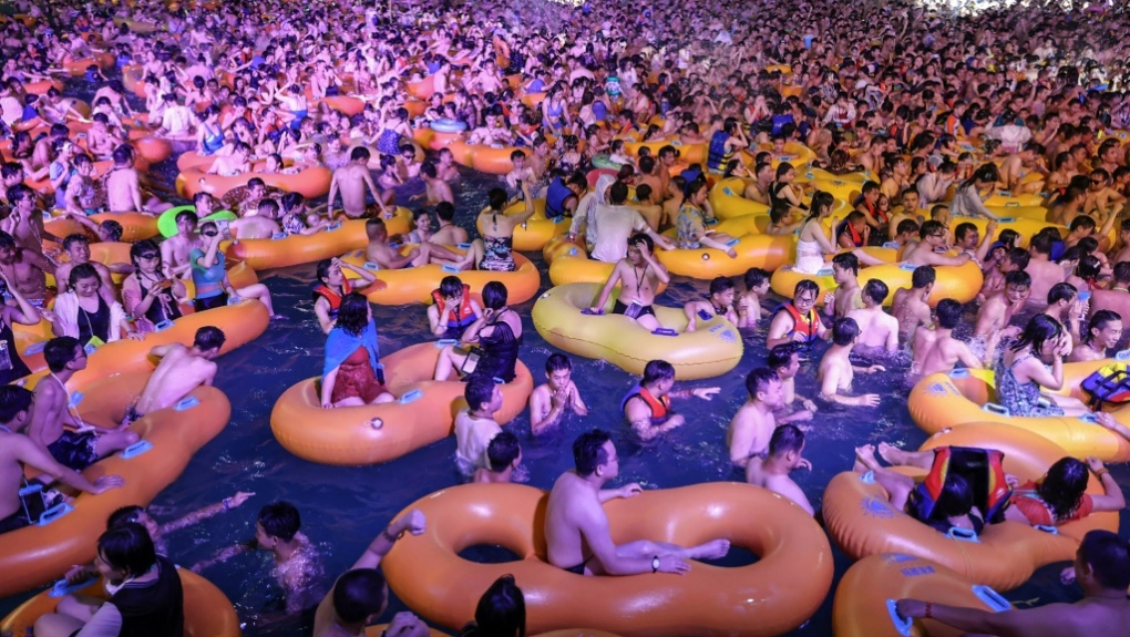 China: Thousands party at Wuhan water park without masks