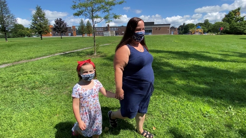 Six-year-old Zoe Smith with mother Jenna MacRae practice mask wearing in anticipation for the start of the school year. (Tyler Fleming / CTV News Ottawa)