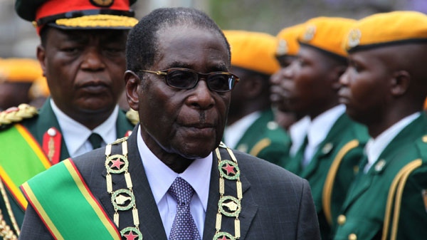 President Robert Mugabe inspects the guard of honour during the official opening of the second session of the seventh parliament of Zimbabwe in Harare, Tuesday, Oct. 6, 2009. (AP / Tsvangirayi Mukwazhi)