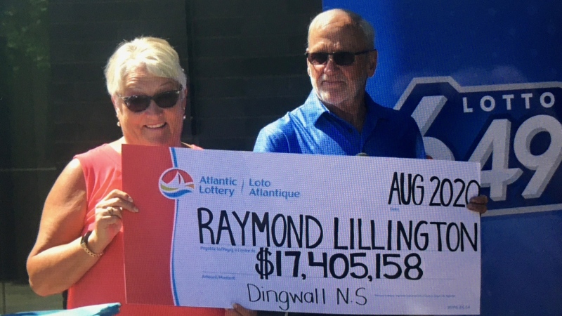 Gaye and Raymond Lillington collect a cheque worth $17.4 million in Halifax on Aug. 19, 2020, after winning a Lotto 6/49 prize. (Mike Lamb/CTV Atlantic)