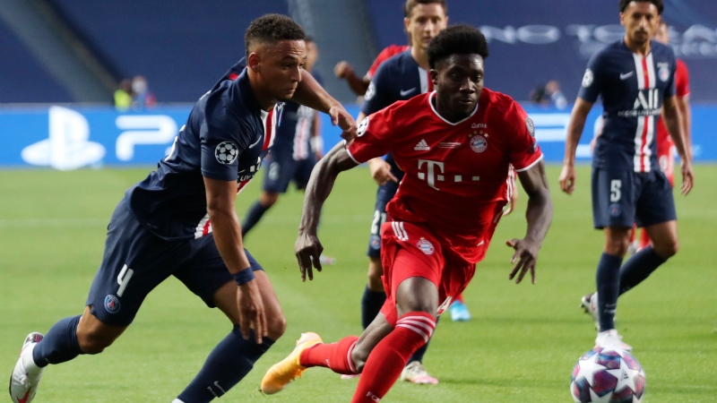 Bayern's Alphonso Davies, right, challenges PSG's Thilo Kehrer, left, during the Champions League final soccer match between Paris Saint-Germain and Bayern Munich at the Luz stadium in Lisbon, Portugal, Sunday, Aug. 23, 2020. (Miguel A. Lopes/Pool via AP)