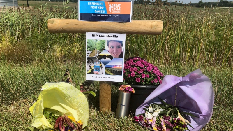 A roadside tribute to Lori Neville, who was struck and killed while cycling in a cancer fundraiser, is seen on Petrolia Line in St. Clair Township, Ont. on Monday, Aug. 24, 2020. (Jordyn Read / CTV News)