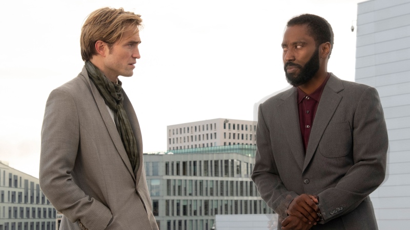 This image released by Warner Bros. Entertainment shows Robert Pattinson, left, and John David Washington in a scene from "Tenet." (Melinda Sue Gordon/Warner Bros. Entertainment via AP)