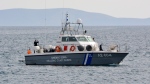 In this file photo, a coast guard vessel arrives at the port of Pythagorio on the eastern Greek island of Samos, Saturday, March 17, 2018. (AP Photo/Michael Svarnias)
