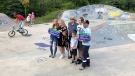 Mike Racicot's family showing off the new signs at Treehouse Mike Skatepark in Barrhaven. (Dave Charbonneau / CTV News Ottawa)