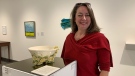 Monique Martin stands next to one of the pieces from her Foundation of Gratefulness series at the Saskatchewan Craft Council.  (Nicole Di Donato/CTV News)