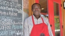 Laurent Coulibaly, owner of Laurent's Ice Cream and Cafe, in front of his cafe in Burnstown. (Yona Harvey, Local Journalism Initiative Reporter)