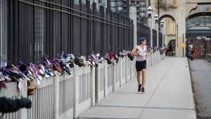 Pairs of shoes line Vancouver's Burrard Street Bridge in memory of those who have died of overdose. (Photos from Darryl Dyck / The Canadian Press, captured on Monday, Aug. 31, 2020 – International Overdose Awareness Day)