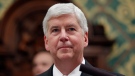 In this Jan. 23, 2018, file photo Michigan Gov. Rick Snyder delivers his State of the State address to a joint session of the House and Senate at the state Capitol in Lansing, Mich. (AP Photo/Al Goldis, File)