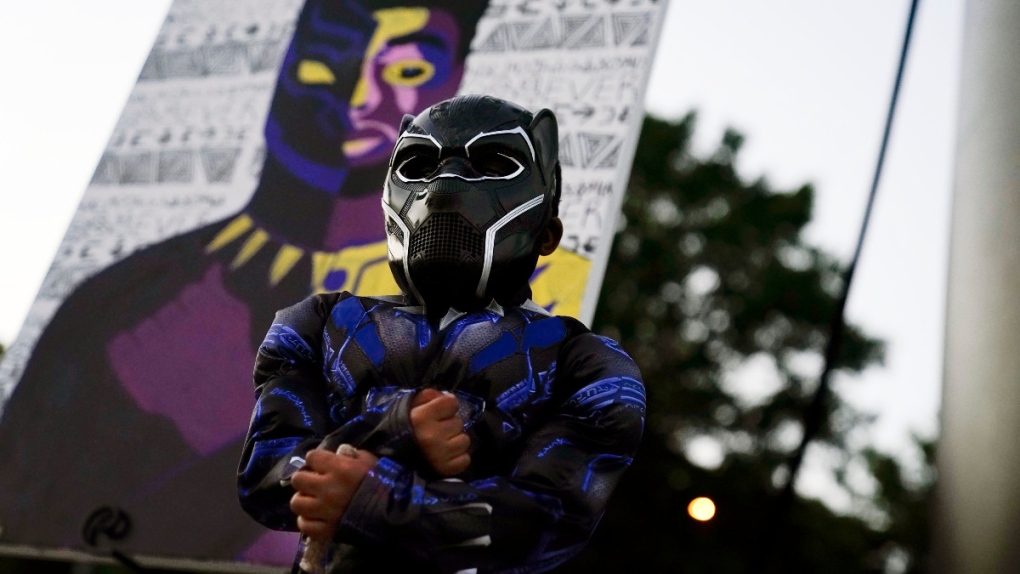 Posing in a Black Panther costume