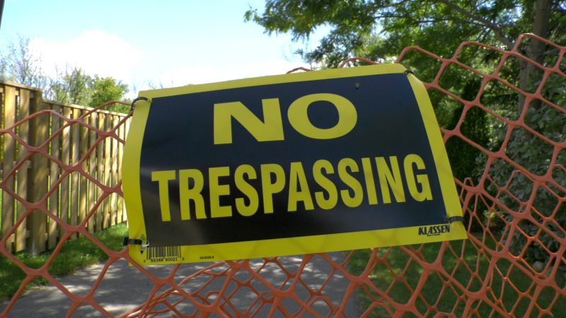 A no trespassing sign at an entrance to the Brock Trail in Brockville, Ont. (Nate Vandermeer / CTV News Ottawa)