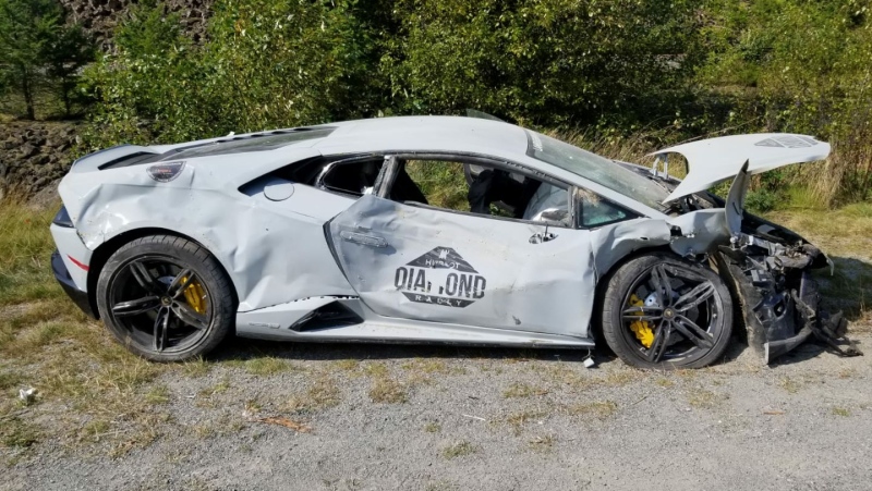 An RCMP photo shows a silver Lamborghini with a Diamond Hublot Rally decal on its door. The luxury car was involved in Saturday's crash near Whistler.