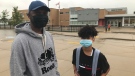 Ahmat Mohammed stands with his son, Sair, in front of Gabriel-Dumont French first language school in London, Ont. on Tuesday, Sept. 8, 2020. (Sean Irvine / CTV News)