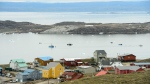 Small boats make their way through the Frobisher Bay inlet in Iqaluit on Friday, Aug. 2, 2019. THE CANADIAN PRESS/Sean Kilpatrick