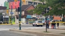 Police are seen at Nassau Street near Spadina Avenue after a quadruple shooting on Aug. 8, 2021. (Ken Enlow/CP24)