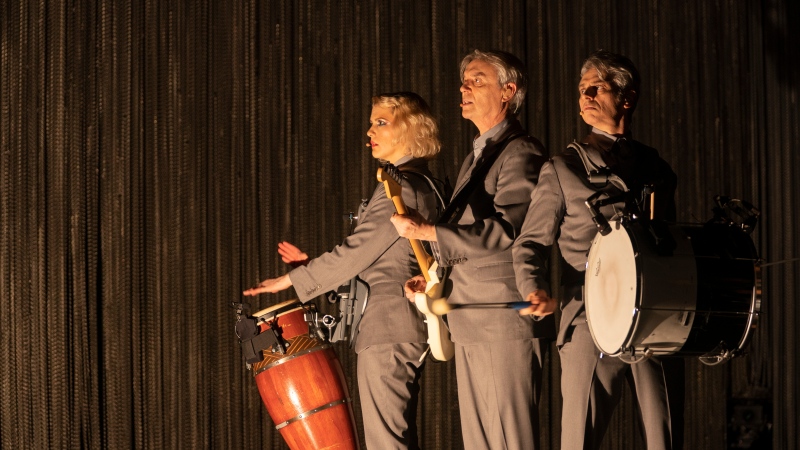 Toronto-born percussionist Jacqueline Acevedo, left, performs alongside David Byrne, centre, and Mauro Refosco in "American Utopia." The Spike Lee-directed concert film opens this year's Toronto International Film Festival. THE CANADIAN PRESS/HO - HBO, David Lee
